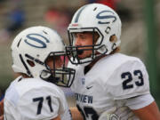 Skyview&#039;s Hayden Froeber (23) celebrates a touchdown with teammate Ryan Hull. Froeber rushed for 209 yards and three touchdowns in a win over Mountain View.