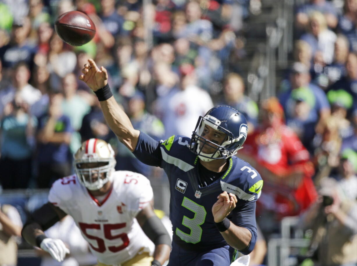 Seattle Seahawks quarterback Russell Wilson throws against the San Francisco 49ers in the first half of an NFL football game, Sunday, Sept. 25, 2016, in Seattle. (AP Photo/Ted S.