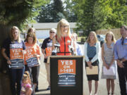 Marilyn Balcerak, whose son fatally shot himself and his stepsister, speaks to media Thursday about Initiative 1491 in the Five Corners area. Initiative 1491 would create extreme-risk protection orders, allowing families and law enforcement to petition a court to temporarily suspend a person&#039;s access to firearms if there is documented evidence that an individual is threatening harm to themselves or others.