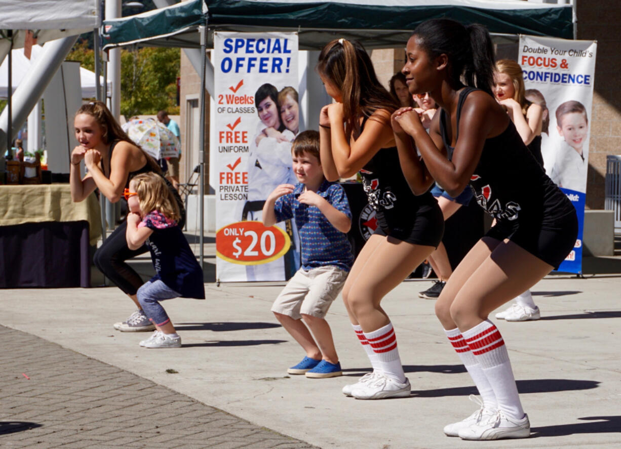 Camas: Members of the Camas High School dance team instructing kids at the Student Health Advisory Council&#039;s second Camas 4 Kids Health Fair.