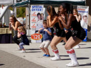 Camas: Members of the Camas High School dance team instructing kids at the Student Health Advisory Council&#039;s second Camas 4 Kids Health Fair.