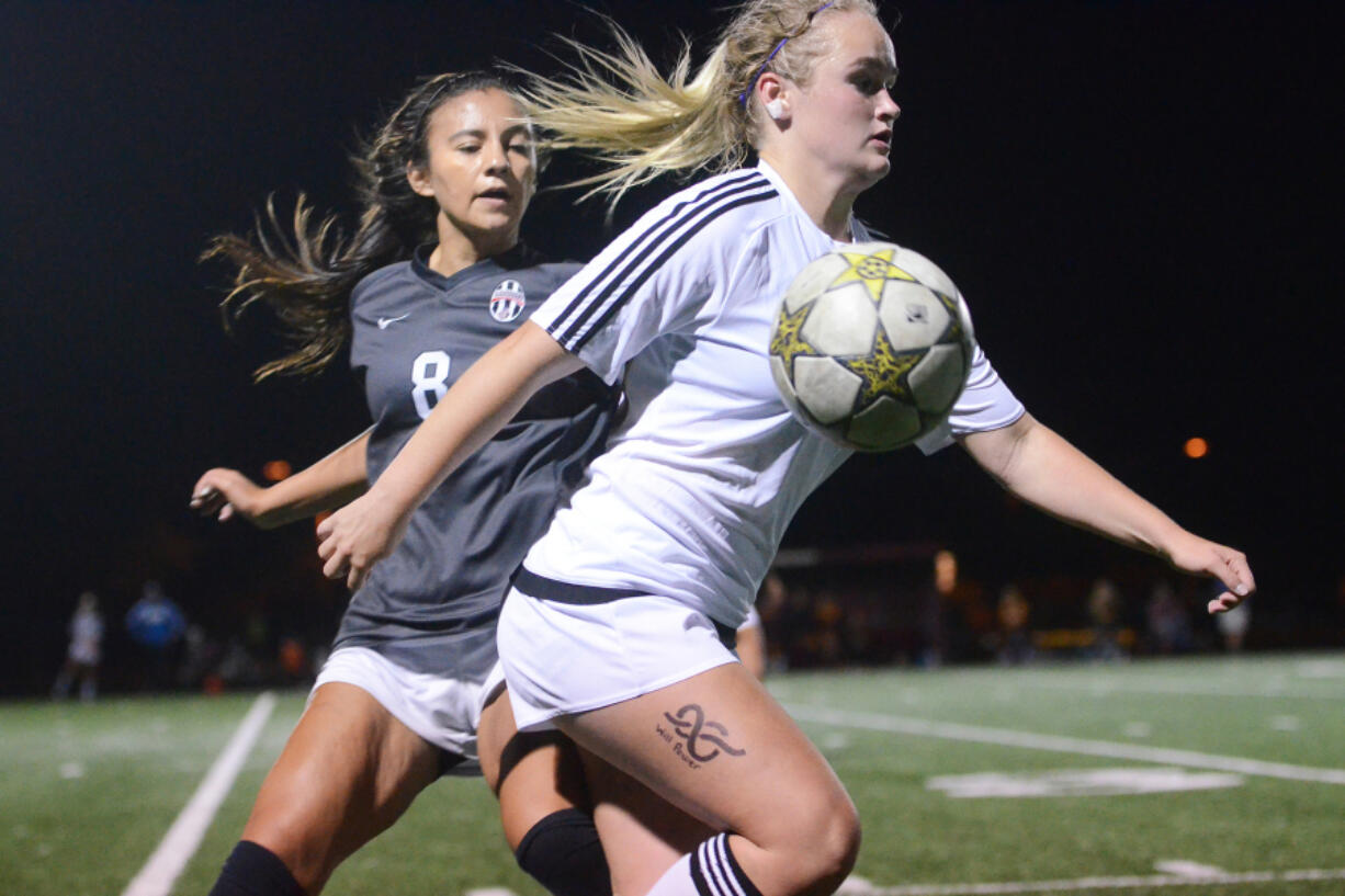 Prairie junior Kendal Spencer protects the ball from Union junior Kiani Pandoliano during Prairie&#039;s 1-0 victory over Union in a non-league match.