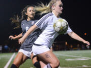 Prairie junior Kendal Spencer protects the ball from Union junior Kiani Pandoliano during Prairie&#039;s 1-0 victory over Union in a non-league match.