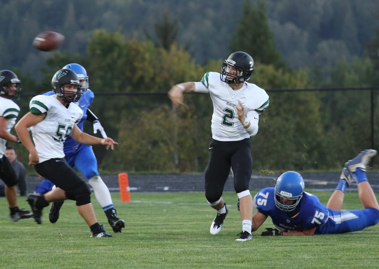 Woodland's Wyatt Harsh throws the ball at a game against Woodland in La Center, Friday September 9, 2016.