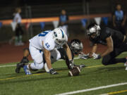 Unionis Kai Gamble (7) steals the ball from Mountain Viewis Alex Ferruzca (60), making a touchdown in the second quarter, Friday September 9, 2016, at McKenzie Stadium.