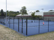 Women play tennis in the newly re-built outdoor tennis courts at the Vancouver Tennis Center, Tuesday August 30, 2016.