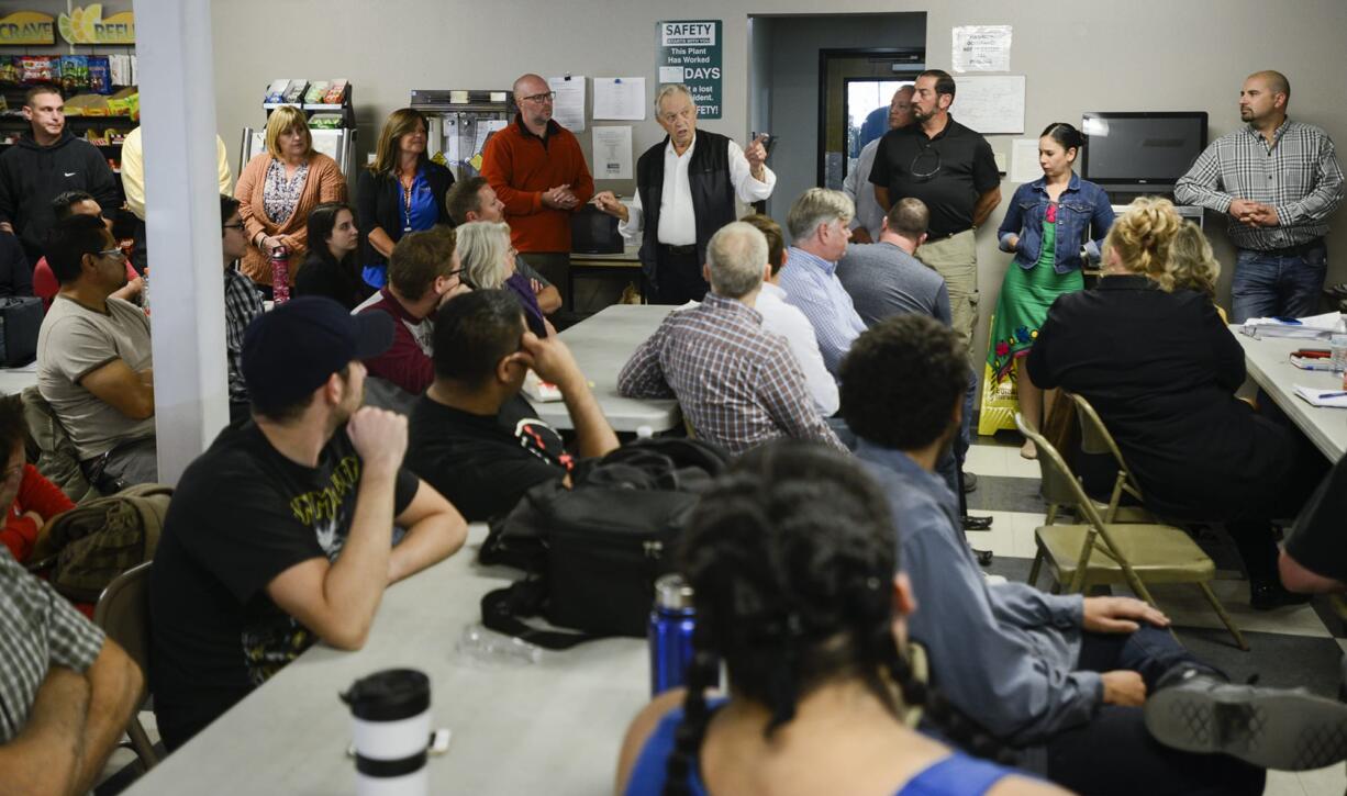 CEO of Cadet Dick Anderson, center back, announces to employees that he is selling the business to an Irish company, Glen Dimplex, Wednesday September 21, 2016 at Cadet in Vancouver.