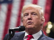 Republican presidential candidate Donald Trump speaks Wednesday during a campaign rally in Toledo, Ohio. In the final sprint to Election Day, Donald Trump faces a daunting series of roadblocks in the minds of Americans as he tries to catch up to Hillary Clinton.