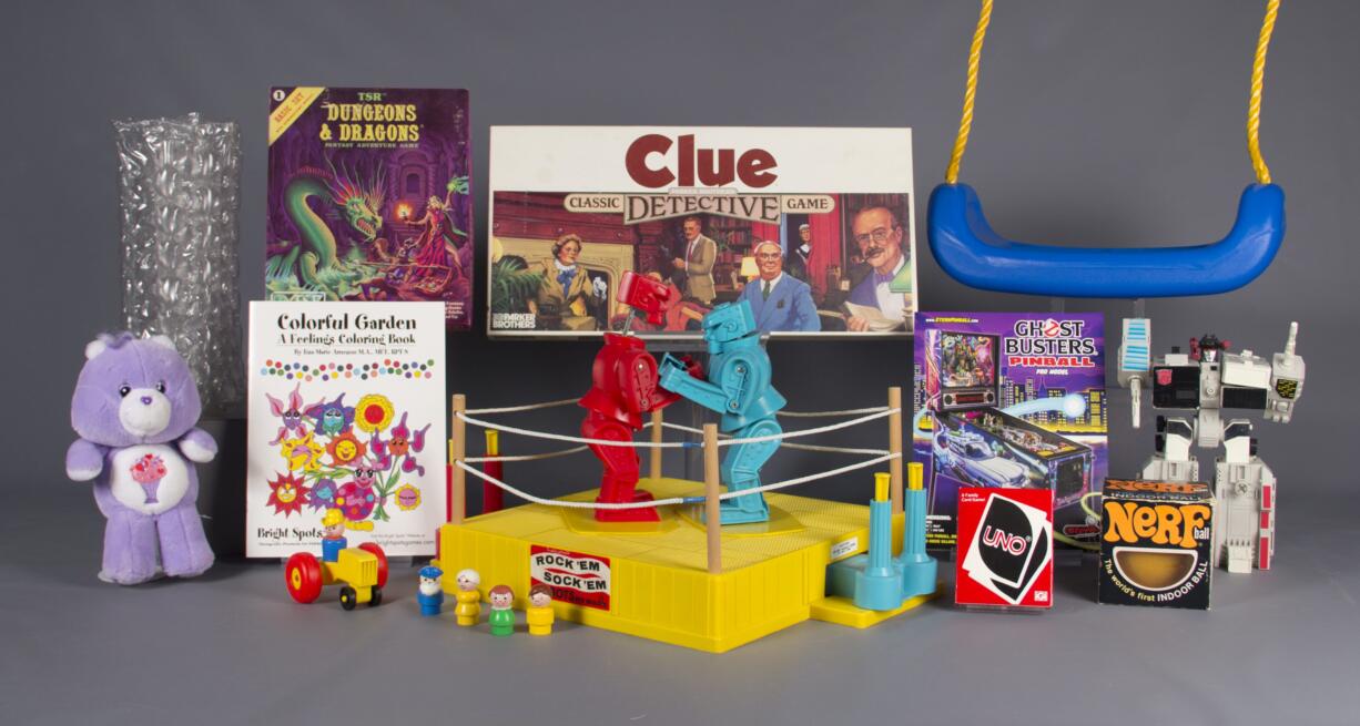 In this Aug. 10, 2016 photo provided by The Strong museum in Rochester, N.Y., are the 12 finalists for the class of 2016 for induction into the National Toy Hall of Fame: bubble wrap, Care Bears, Clue, coloring books, Dungeons &amp; Dragons, Fisher-Price Little People, Nerf, pinball, Rock 'Em Sock 'Em Robots, swing, Transformers, and Uno. The winners will be chosen with input from a national selection committee and inducted on Nov. 10.