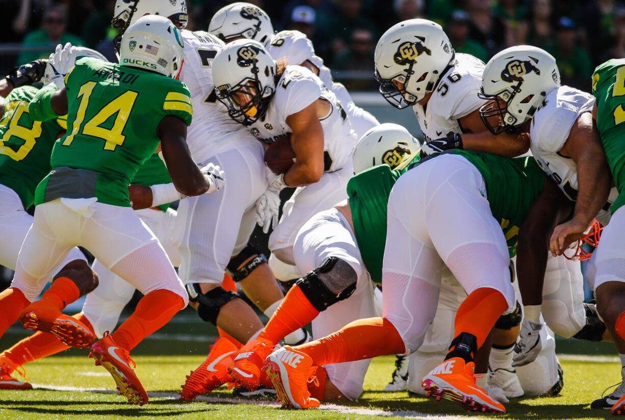 Colorado Buffaloes running back Phillip Lindsay (23), scores a touchdown in the first half against Oregon in an NCAA college football game Saturday, Sept. 24, 2016 in Eugene, Ore.