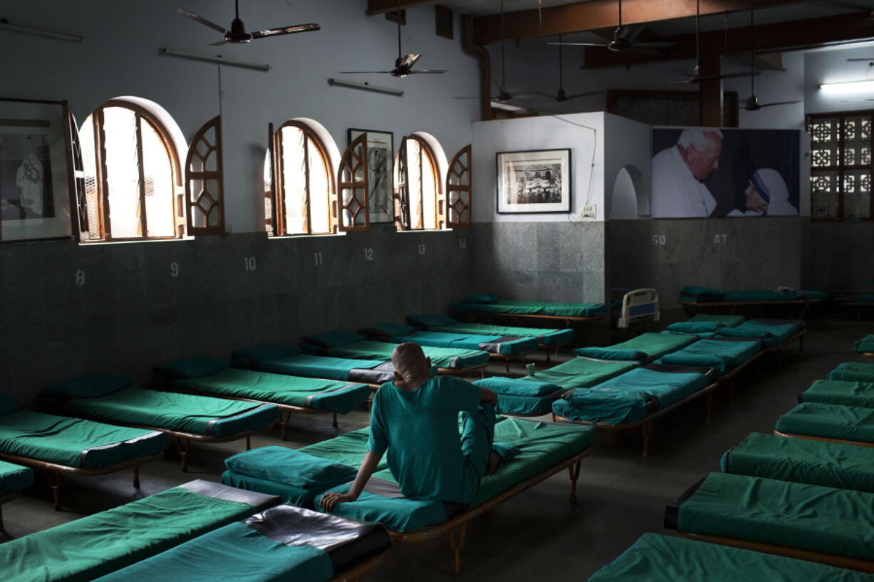 An inmate sits on his bed at &#039;Nirmal Hriday Kalighat, Mother Teresa&#039;s home for the dying and destitute in Kolkata, India, on Friday.