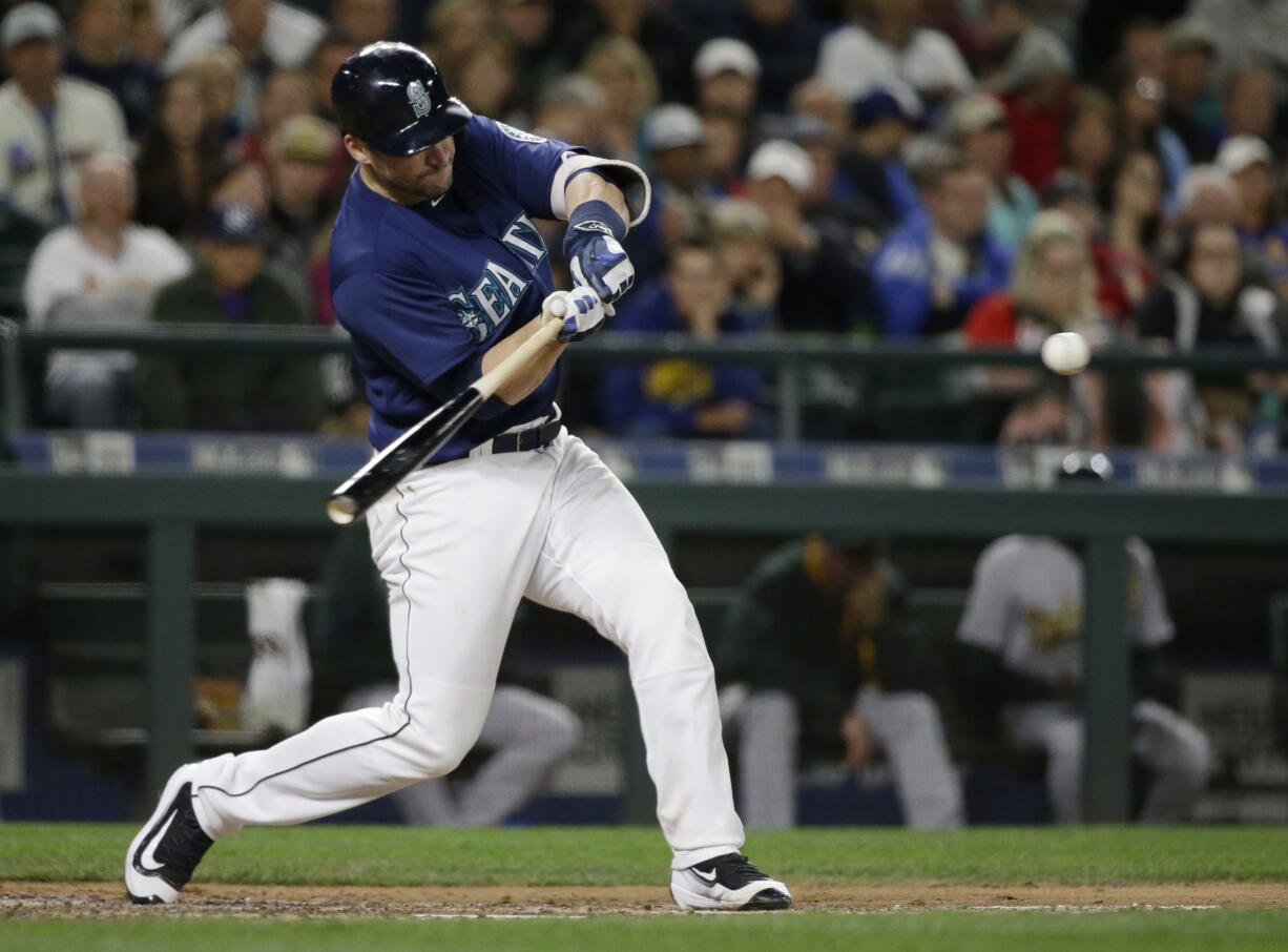 Seattle Mariners' Mike Zunino hits a solo home run against the Oakland Athletics during the seventh inning of a baseball game, Thursday, Sept. 29, 2016, in Seattle. (AP Photo/Ted S.