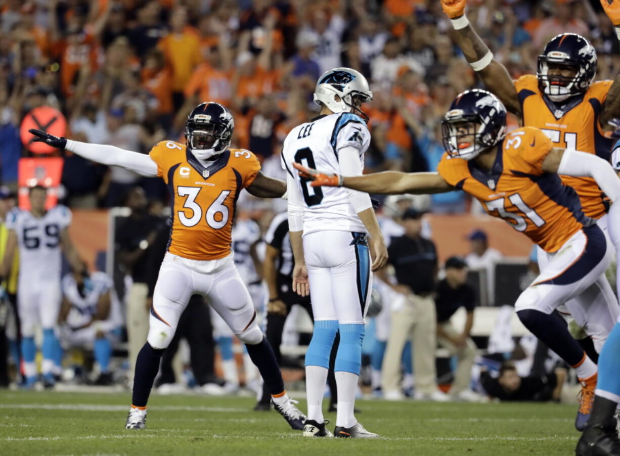 Denver Broncos cornerback Kayvon Webster (36) celebrates Carolina Panthers punter Andy Lee's (8) missed field goal during the second half of an NFL football game, Thursday, Sept. 8, 2016, in Denver. The Broncos won 21-20.