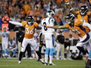 Denver Broncos cornerback Kayvon Webster (36) celebrates Carolina Panthers punter Andy Lee's (8) missed field goal during the second half of an NFL football game, Thursday, Sept. 8, 2016, in Denver. The Broncos won 21-20.