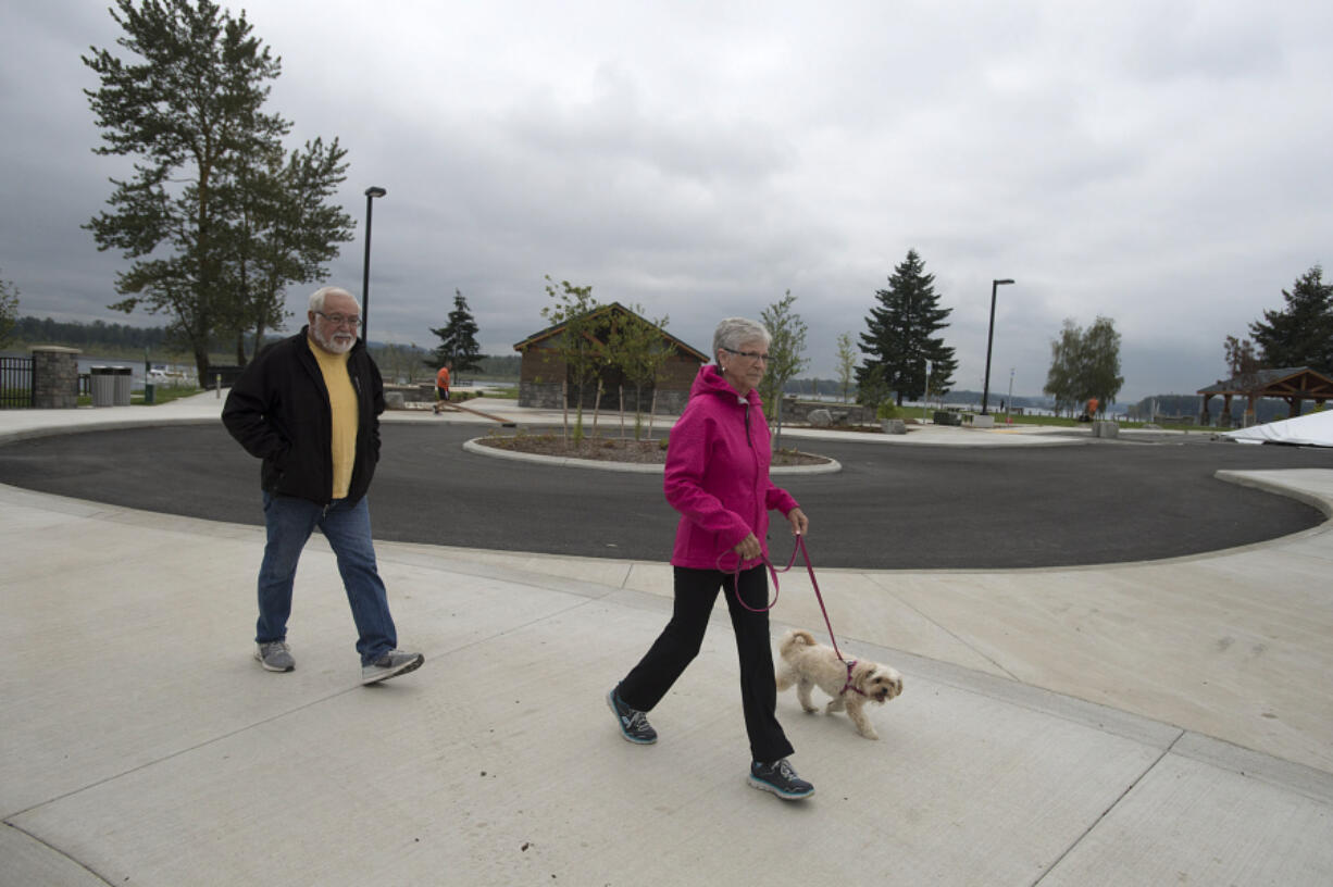 Harry and Dorothy Fisher of Washougal walk their dog, Daisy, at the new Washougal Waterfront Park near the Port of Camas-Washougal on Thursday.