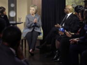 Democratic presidential candidate Hillary Clinton speaks with African American ministers, in Detroit.