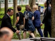 Democratic presidential candidate Hillary Clinton, second from right, departs after attending a ceremony at the Sept. 11 memorial, in New York, Sunday, Sept. 11, 2016, on the 15th anniversary of the Sept. 11 attacks.