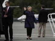 Democratic presidential candidate Hillary Clinton waves before boarding her campaign plane at Westchester County Airport in White Plains, N.Y., on Wednesday.