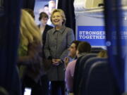 Democratic presidential candidate Hillary Clinton meets with her staff before taking off on her campaign plane at Westchester County Airport in White Plains, N.Y., on Thursday.