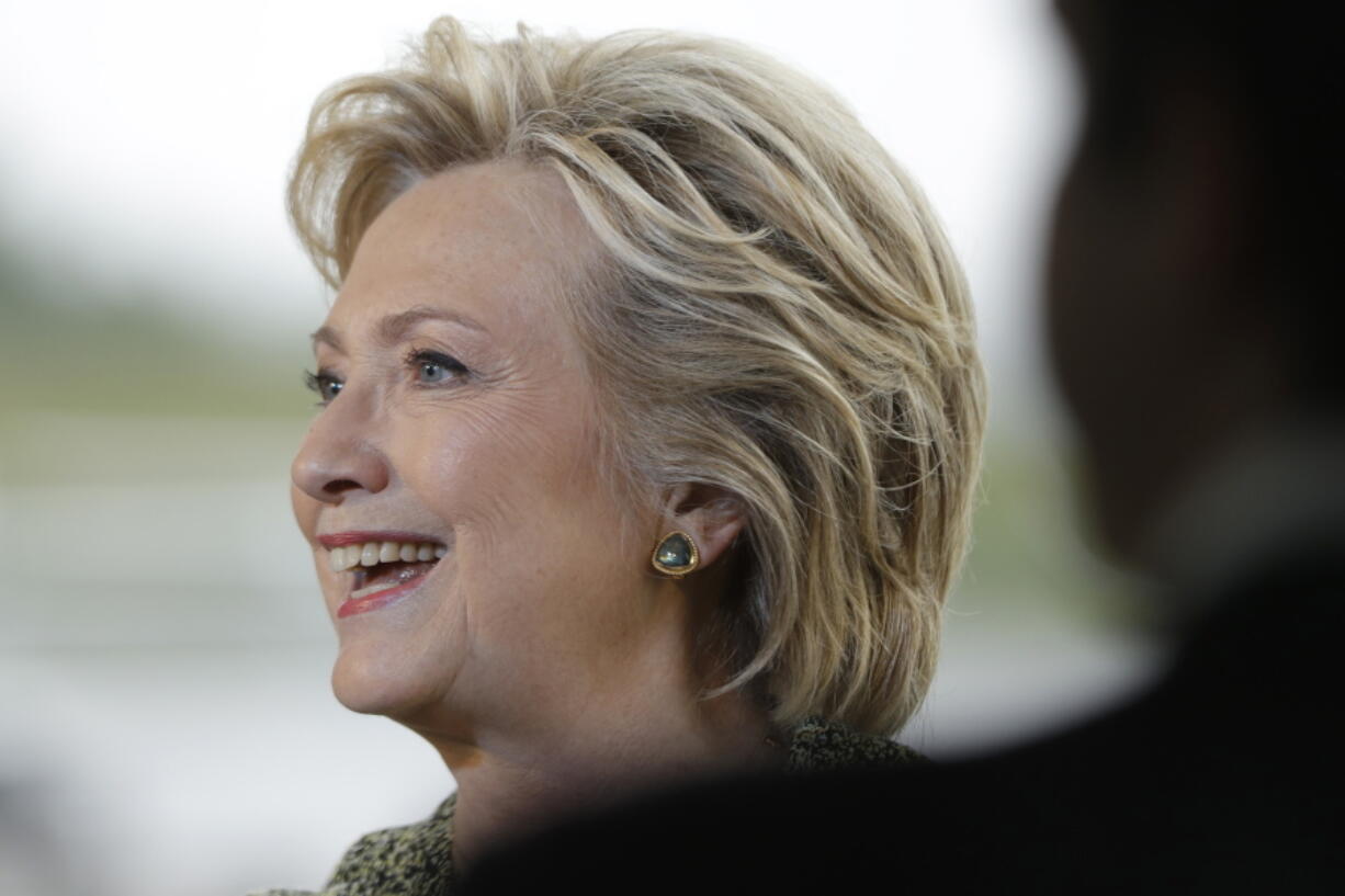 Democratic presidential candidate Hillary Clinton smiles at the end of a news conference at Westchester County Airport in White Plains, N.Y., on Monday.