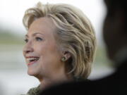 Democratic presidential candidate Hillary Clinton smiles at the end of a news conference at Westchester County Airport in White Plains, N.Y., on Monday.