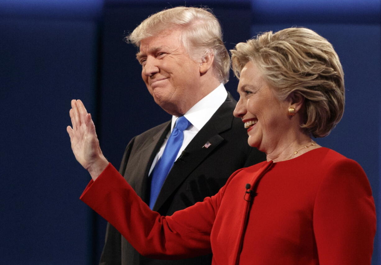 Republican presidential candidate Donald Trump, left, stands with Democratic presidential candidate Hillary Clinton at the first presidential debate at Hofstra University, Monday, Sept. 26, 2016, in Hempstead, N.Y.