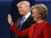 Republican presidential candidate Donald Trump, left, stands with Democratic presidential candidate Hillary Clinton at the first presidential debate at Hofstra University, Monday, Sept. 26, 2016, in Hempstead, N.Y.