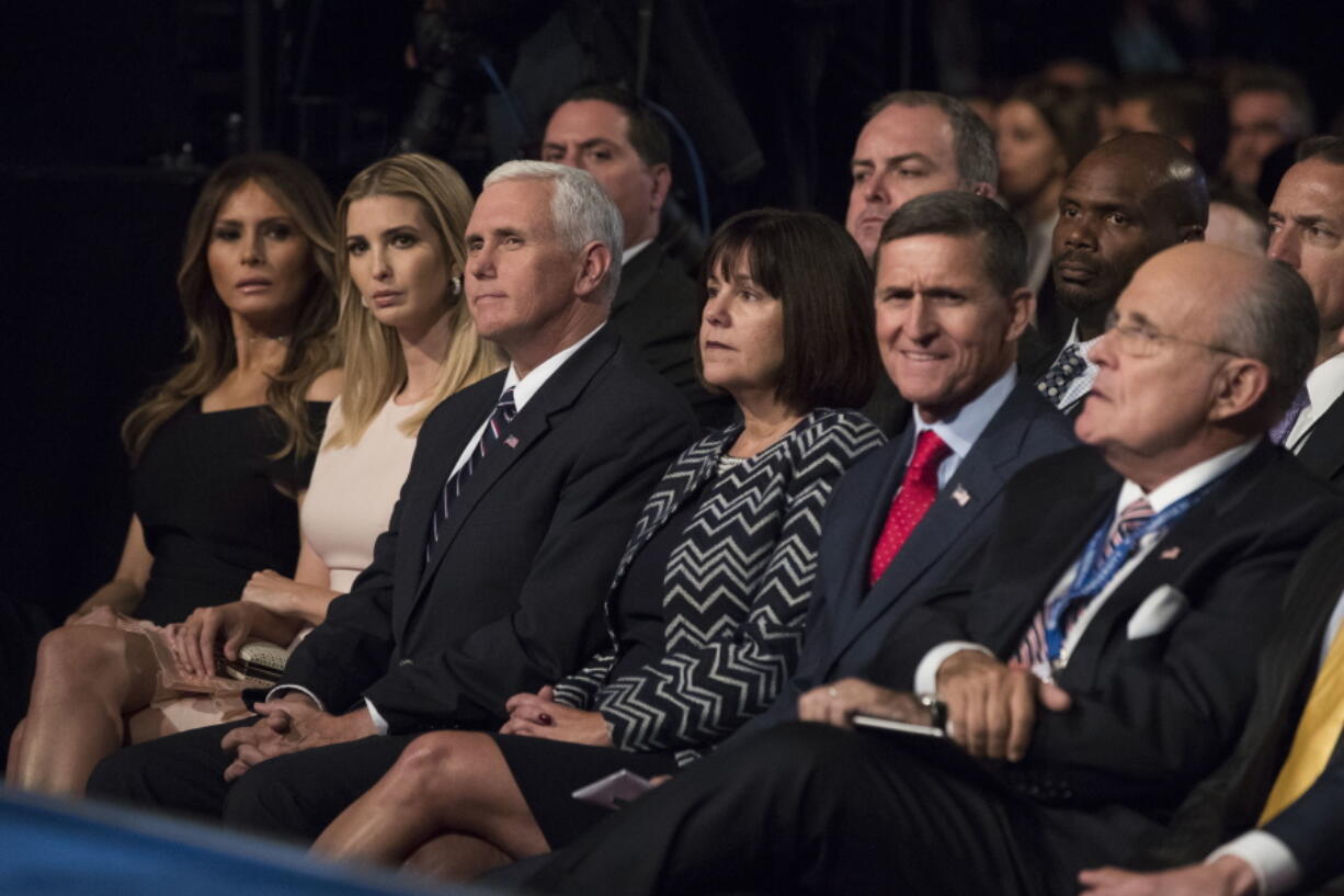 Republican vice presidential candidate Indiana Gov. Mike Pence, center left, waits for the start of the first presidential between Republican presidential candidate Donald Trump and Democratic presidential candidate Hillary Clinton at Hofstra University in Hempstead, N.Y., on Monday.