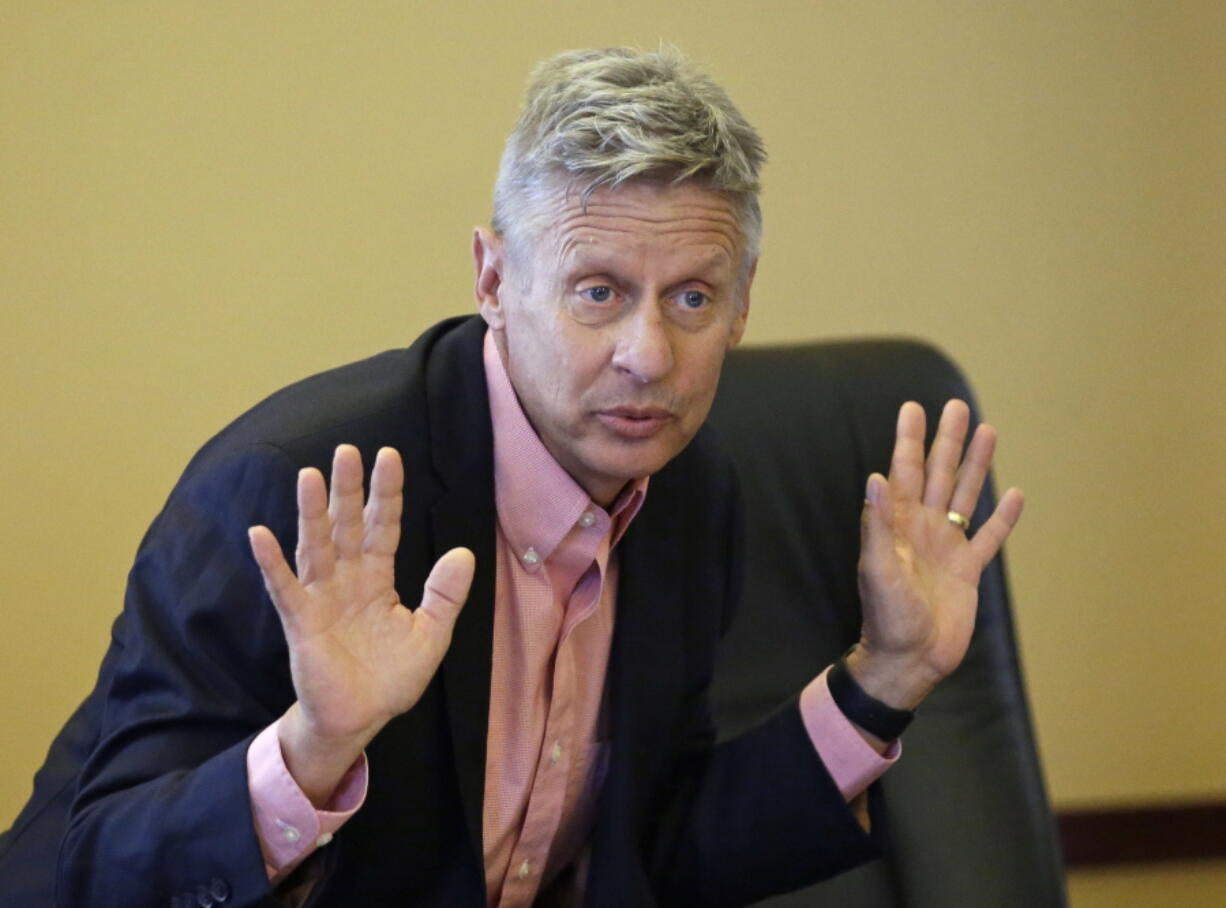 FILE - In this May 18, 2016 file photo, Libertarian presidential candidate, former New Mexico Gov. Gary Johnson speak with legislators at the Utah State Capitol in Salt Lake City. If Hillary Clinton carries Arizona in November, there???s a good chance it won???t be because the Democratic Party alone has picked off a reliably red state it believes will someday be consistently blue. Instead, she may have Gary Johnson to thank. The Libertarian Party nominee???s best chance to impact the 2016 presidential race may well be in Arizona, a traditionally Republican state where he appeals to a group of finicky conservatives who make up part of the party???s base.