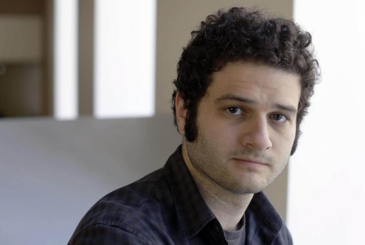 Dustin Moskovitz, a Facebook co-founder, poses April 26, 2012, outside of his office in San Francisco.