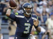 Seattle Seahawks quarterback Russell Wilson passes against the Dallas Cowboys during the first half of a preseason NFL football game, Thursday, Aug. 25, 2016, in Seattle.