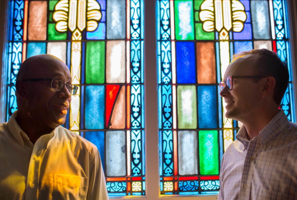 The Rev. James W. Goolsby, Jr., senior pastor of the First Baptist Church, left, and the Rev. Scott Dickison, senior pastor of First Baptist Church of Christ talk in July at Dickison&#039;s church in Macon, Ga. There are two First Baptist Churches in Macon: one black and one white. Two years ago, Dickison and Goolsby met to try to find a way the congregations, neighbors for so long, could become friends. They would try to bridge the stubborn divide of race.