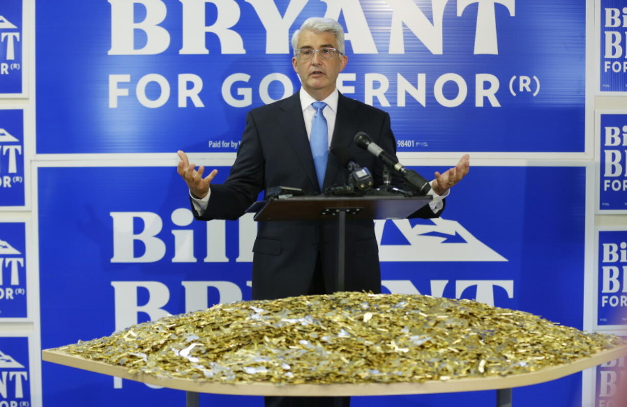 Washington state gubernatorial candidate Bill Bryant, a Republican running against Washington Gov. Jay Inslee, a Democrat, talks to reporters at a press conference, Wednesday in Seattle in front of a table that he said displayed 25,000 key blanks, to represent the number of master keys that corrections officials discovered were missing from Western State Hospital during a security review in response to the escape of two violent patients. Bryant called on Inslee to release reports on staffing and other problems at the state&#039;s largest psychiatric hospital. (AP Photo/Ted S.