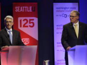 Washington Gov. Jay Inslee, right, a Democrat, and his Republican challenger, Bill Bryant, take part in a debate Monday in Seattle. (AP Photo/Ted S.