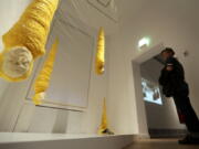 A man looks at the installation &quot;Crisalidas&quot; by Jorge Gil on Thursday at the &quot;Golem&quot; exhibition at the Jewish Museum in Berlin. The myth of artificial life, from homunculi and cyborgs to robots and androids, is the focus of an exhibition that runs until Jan. 29.