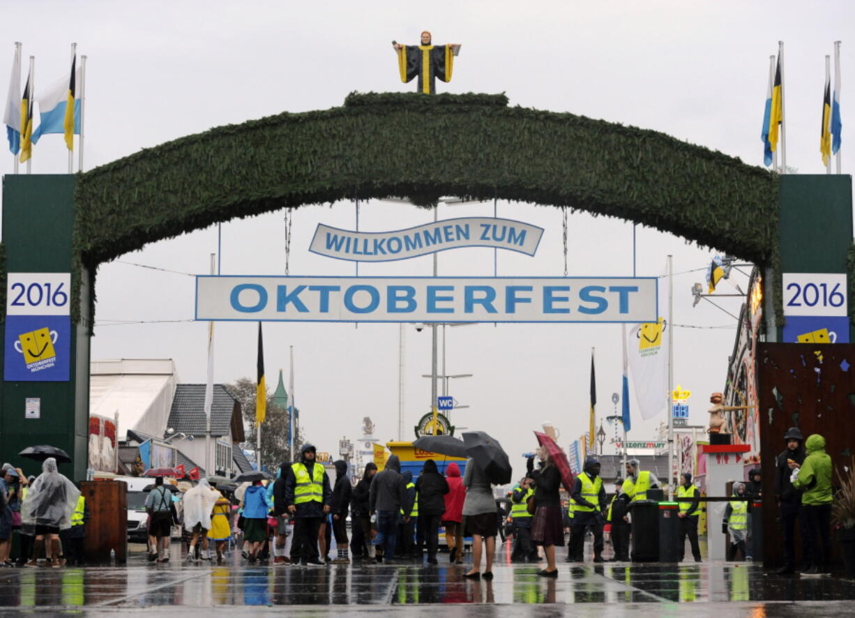 Security personnel work Saturday at the main entrance to the Oktoberfest beer festival in Munich.