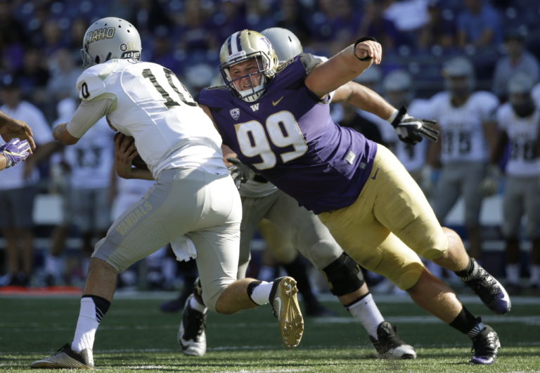 Idaho quarterback Matt Linehan, left, is sacked by Washington defensive lineman Greg Gaines (99) in the first half of an NCAA college football game, Saturday, Sept. 10, 2016, in Seattle. (AP Photo/Ted S.