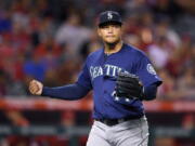 Seattle Mariners starting pitcher Taijuan Walker claps after finishing the fifth inning of a baseball game against the Los Angeles Angels, Tuesday, Sept. 13, 2016, in Anaheim, Calif. (AP Photo/Mark J.