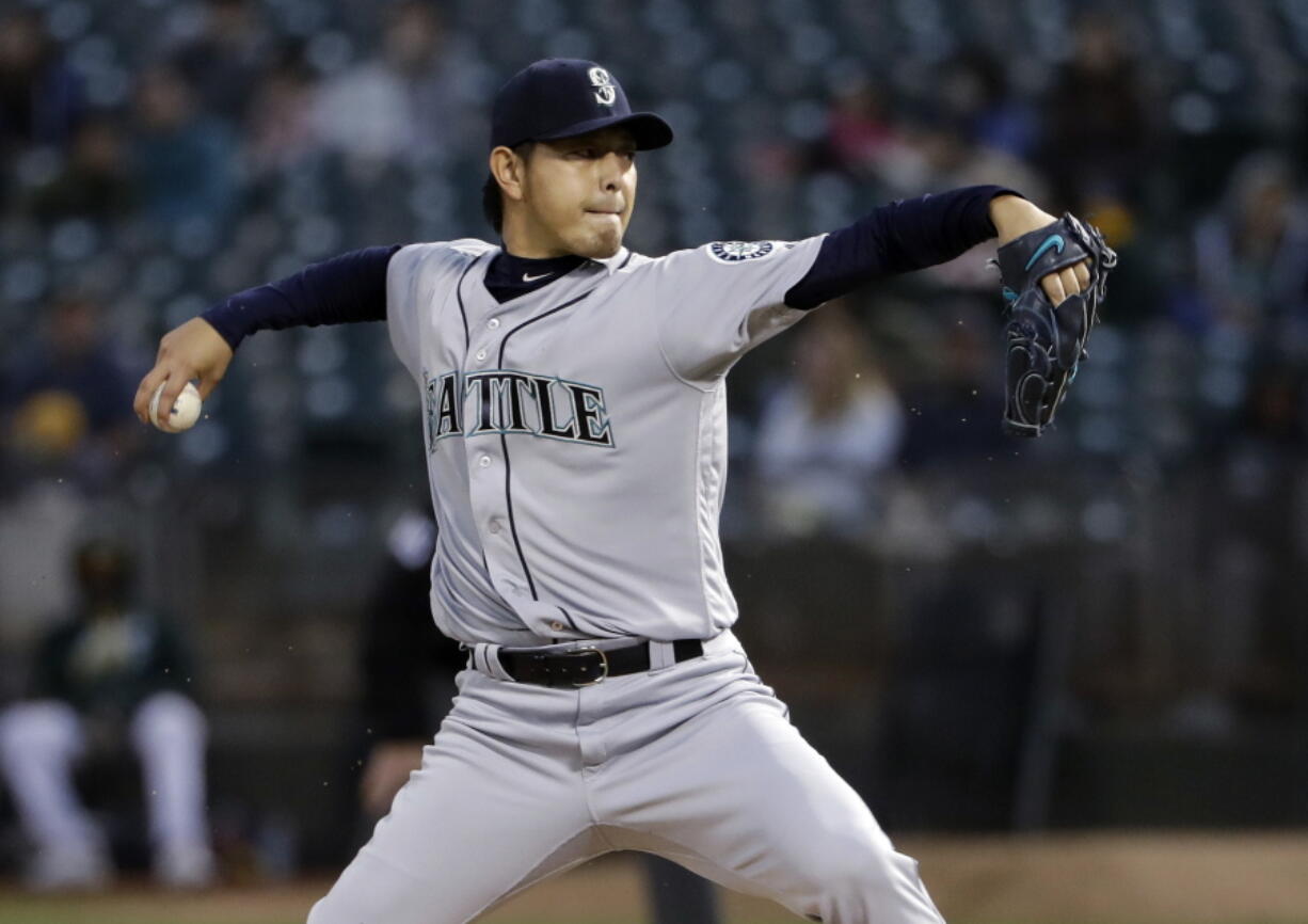 Seattle Mariners starting pitcher Hisashi Iwakuma throws to an Oakland Athletics batter during the first inning of a baseball game Friday, Sept. 9, 2016, in Oakland, Calif.