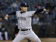 Seattle Mariners starting pitcher Hisashi Iwakuma throws to an Oakland Athletics batter during the first inning of a baseball game Friday, Sept. 9, 2016, in Oakland, Calif.