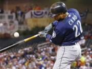 Seattle Mariners' Robinson Cano hits an RBI single off Minnesota Twins pitcher Kyle Gibson during the third inning of a baseball game Friday, Sept. 23, 2016, in Minneapolis.