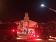 In this photo provided by the St. Lucie Sheriff&#039;s Office, firefighters work at the scene of a fire at the Islamic Center of Fort Pierce on Monday in Fort Pierce, Fla. (St.