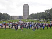 People rally against the Dakota Access Pipeline  on the grounds of the North Dakota state capitol Friday, Sept. 9, 2016 in Bismarck, N.D. The federal government stepped into the fight over the Dakota Access oil pipeline Friday, ordering work to stop on one segment of the project in North Dakota and asking the Texas-based company building it to "voluntarily pause" action on a wider span that an American Indian tribe says holds sacred artifacts.