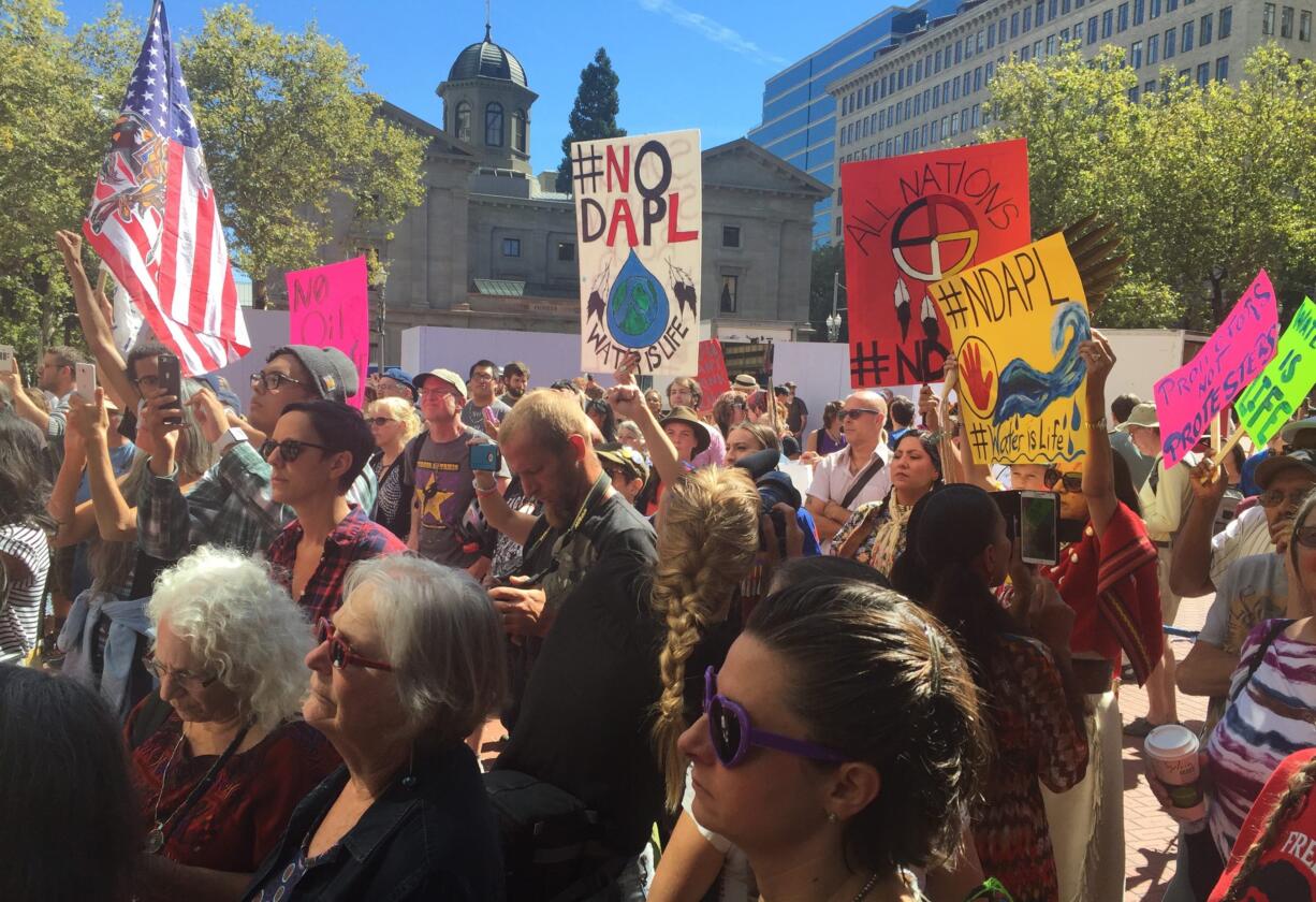 Protestors gather in downtown Portland, Ore., Friday, Sept. 9, 2016, as a show of solidarity with protesters in other states trying to halt the construction of the Dakota Access Pipeline that will move oil from North Dakota to Illinois. A federal judge in Washington on Friday, Sept. 9, 2016, denied an attempt by the Standing Rock Sioux tribe to halt construction of a disputed oil pipeline that passes near its reservation in North Dakota.