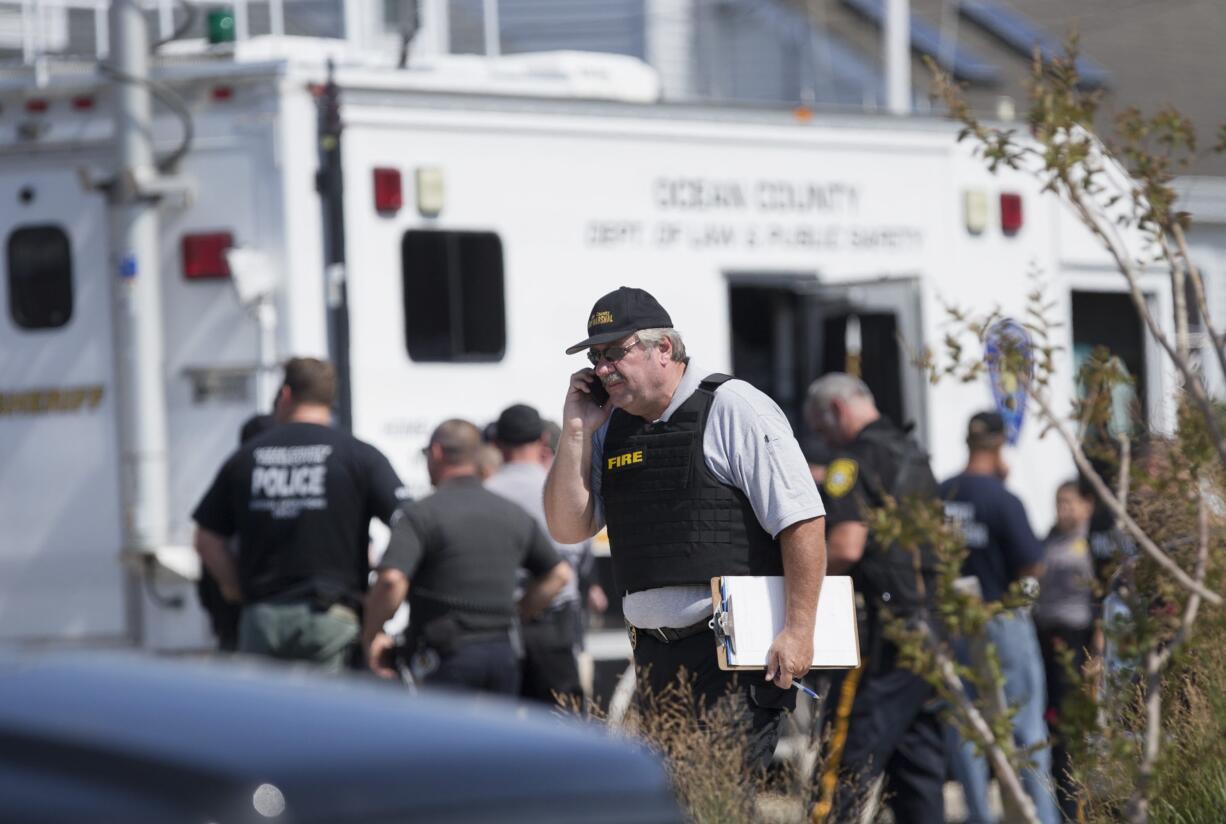 Police gather at a command center in Seaside Park, N.J., on Saturday, Sept. 17, 2016, during an investigation of a pipe bomb which exploded before a charity race to benefit Marines and sailors. No injuries were reported.