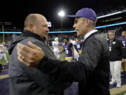 Portland State Vikings head coach Bruce Barnum, left, greets Washington Huskies head coach Chris Petersen, right, after an NCAA college football game, Saturday, Sept. 17, 2016, in Seattle. Washington won 41-3.