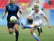 United States&#039; Megan Rapinoe kicks the ball past Sweden&#039;s Lisa Dahlkvist during a quarterfinal match of the women&#039;s Olympic football tournament in Brasilia on Aug. 12.