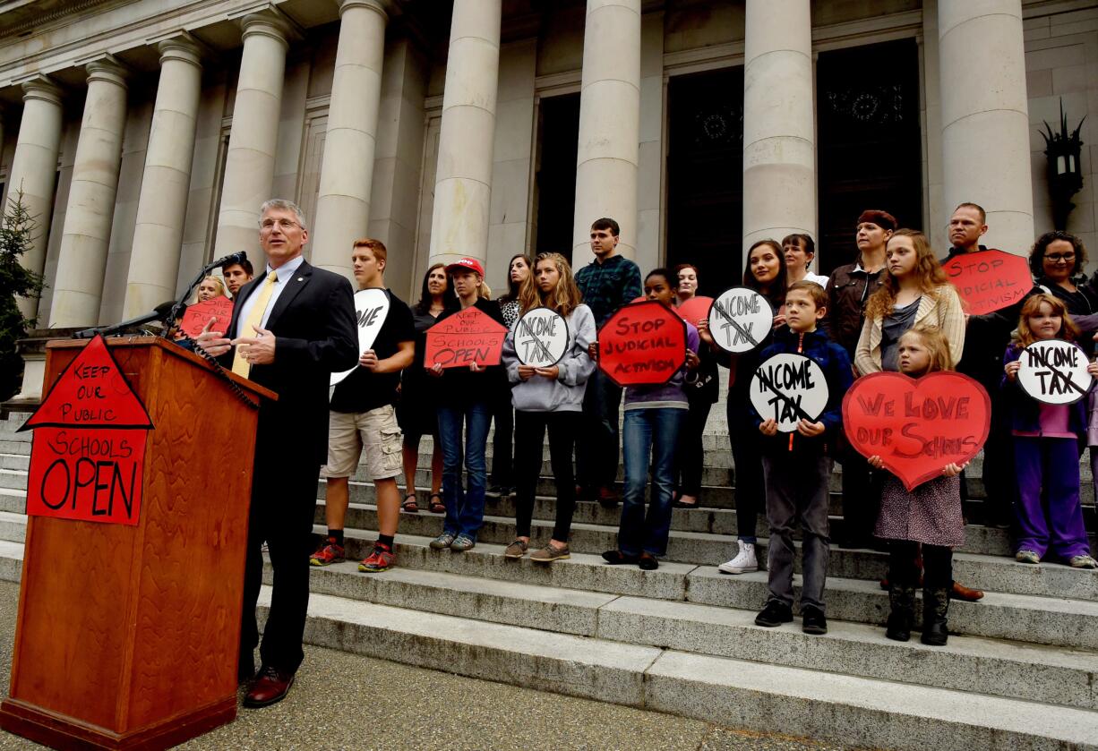 Standing on the steps of the Temple of Justice Building in Olympia, Wash., to start a morning press event on Wednesday, Sept. 7, 2016, State Rep. Chad Magendanz, R-5th District, Issaquah, contends that students, parents and teachers shouldnt have to worry about public schools being shut down by any future state Supreme Court ruling just prior to the start of the court's hearing regarding the McCleary school funding case. Washington state officials will be back before the state Supreme Court for a hearing on the ongoing battle surrounding the state's constitutional requirement to properly fund basic education.