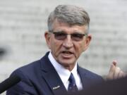 Randy Dorn, Washington state Superintendent of Public Instruction, talks to reporters Wednesday, Sept. 7, 2016, in Olympia, Wash., following a Washington State Supreme Court hearing on the ongoing battle surrounding the state's constitutional requirement to properly fund basic education. (AP Photo/Ted S.