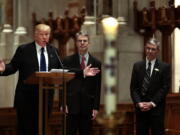 Donald Trump speaks before the funeral for Eagle Forum founder Phyllis Schlafly at Cathedral Basilica of St. Louis on Saturday, Sept. 10, 2016. Schlafly's sons Andrew and John, right, join Trump on the altar.  (Robert Cohen/St.